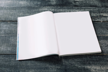 Mock-up clean magazine or catalog on wooden table. Blank page or notepad on wood background.