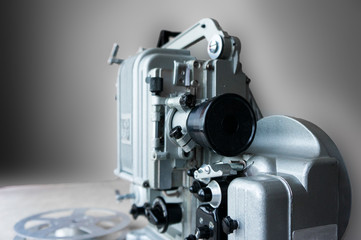 Old projector for showing films on a blurred background