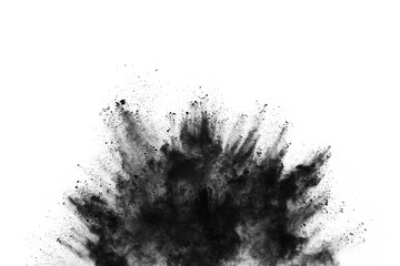Closeup of black dust particles explode isolated on white background..