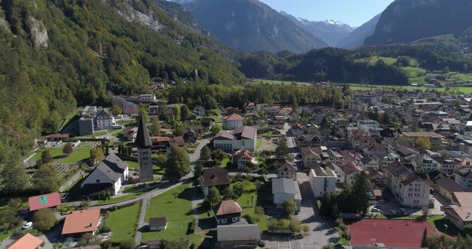 Meiringen church approaching travelling - Aerial 4K