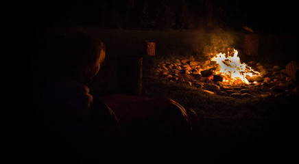 Camping under the stars by the fire