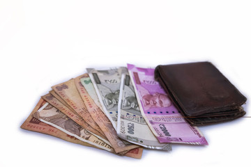 Indian currency notes 500 & 2000 rupee notes with wallet - white background with space for text