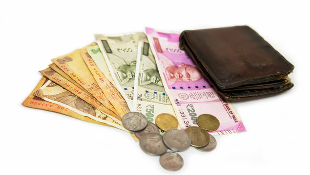 Indian Currency Two Thousand and Five Hundred with Coins and Wallet - white background with space for text