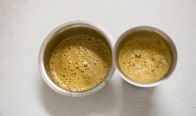 Indian filter coffee is famous coffee in steel cup.