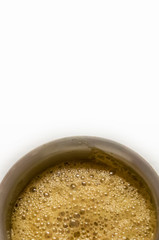 South Indian coffee served in steel glasses - white background with space for text