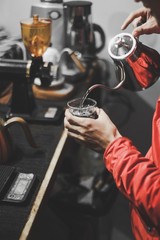 hand holding a glass of a water