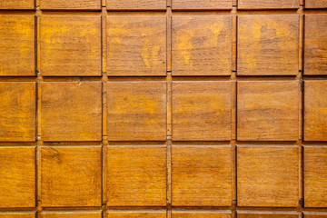 Detail of a wooden door with squares