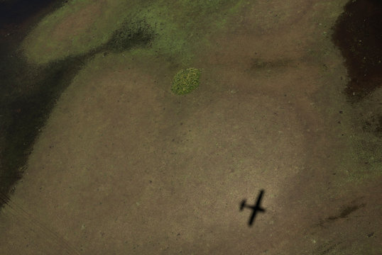 Shadow Of Airplane Flying Over Brazilian Wetlands, Know As Pantanal, In Mato Grosso Do Sul State, Central-West Region Of The Country