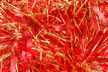 Red Christmas tinsel texture and background