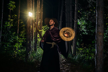 Halloween cosplay with a wooden magic staff and pendulum