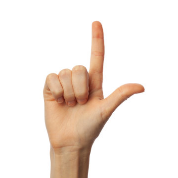 Finger spelling letter L in American Sign Language on white background