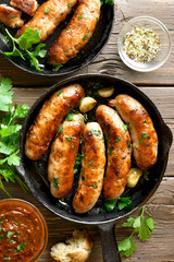 Fried sausages in frying pan
