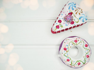 christmas decoration and garland lights on white wooden background