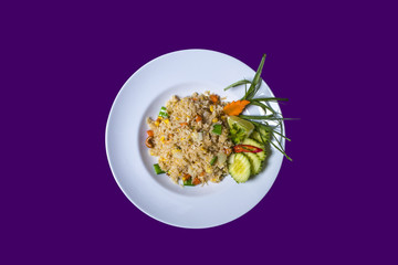 Asian Thai food on white plates with purple background with copy space