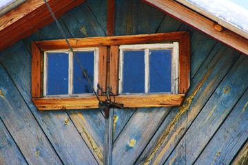 Windows of an old blue house
