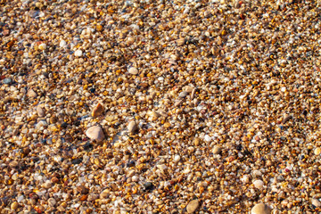 sea pebbles colored granite on the beach