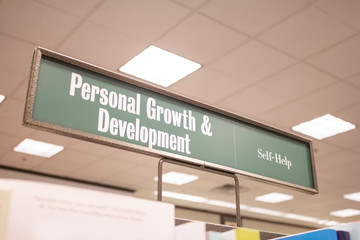 A genre sign at a local bookstore chain for books on the subject of Personal Growth and Development