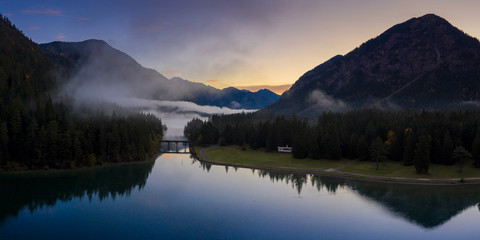 channel bridge between heiterwanger see and lake plansee at dawn