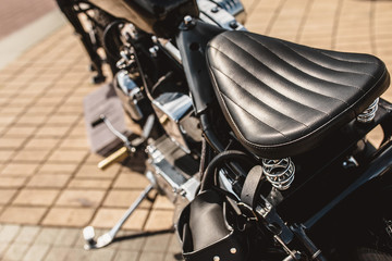 Fototapeta na wymiar Leather motorcycle seat - vintage handmade technique