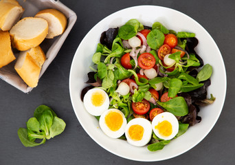 Salad egg mixed with spinach tomatoes, meal food delicious diet for healthy.
