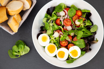 Salad egg mixed with spinach tomatoes, meal food delicious diet for healthy.