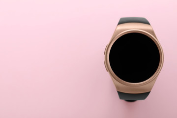 Trendy smart watch on pink background, top view. Space for text
