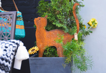Rusty metal decoration in the shape of a cat
