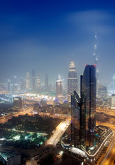 Fototapeta premium Dubai city at night, United Arab Emirates. vertical view