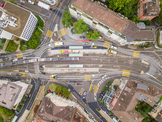 Obraz na płótnie Canvas Aerial view of buildings with roofs. Streets with traffic in overhead view. Town in Europe from above..