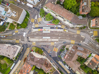 Aerial view of buildings with roofs. Streets with traffic in overhead view. Town in Europe from above..