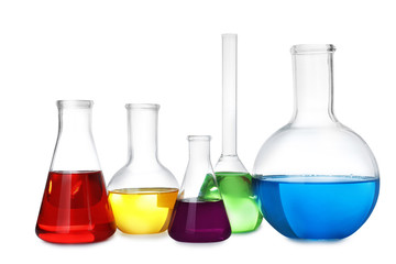 Laboratory glassware with color liquids on white background