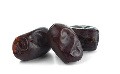 A few dried dates. Isolated on white background.