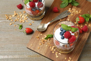 Tasty homemade granola dessert served on wooden table. Healthy breakfast