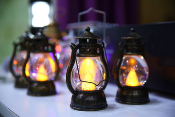 Old small oil Lamps in vintage,retro tone . Vintage small old kerosene lamps on a wooden background...