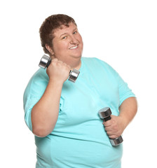 Naklejka premium Overweight man with dumbbells on white background