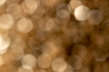 A portrait of a nice gold color bokeh background. The golden blur is something magical.