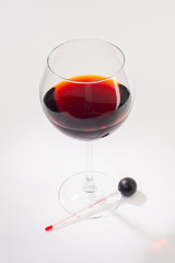 Glass of red wine on a white background and with soft shadow.