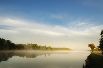 Fototapeta na wymiar Misty morning on Uby lake, France