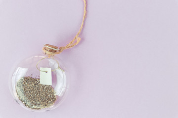 Magic decorative bottle with gold glitter and empty blank for text inside. Top view. Place for your text.