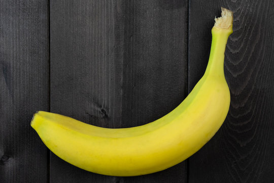 Banana on a dark wood background
