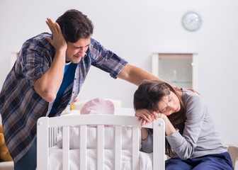 The young dad cannot stand baby crying