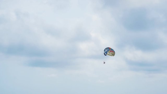 Flying skydiver on a background of cloudy sky.1920X1080 Full Hd.