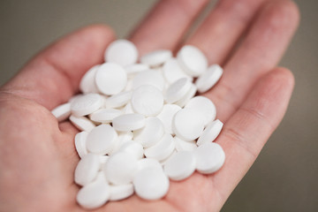 pills on the hand White Aspirin macro shot - Image