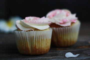Delicious cupcakes with cream on the table