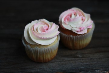 Delicious cupcakes with cream on the table