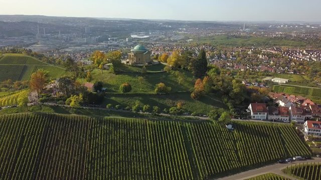 Aerial of the Grave Chapel (Grabkapelle) on Rotenberg and surrounding industrial area with museums and soccer stadium on a beautiful autumn day in Stuttgart, Germany