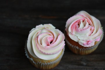 Delicious cupcakes with cream on the table