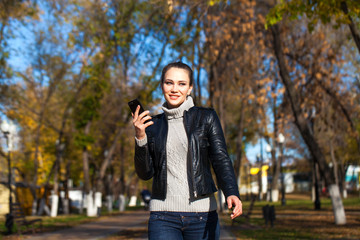 Young beautiful model in a black leather jacket