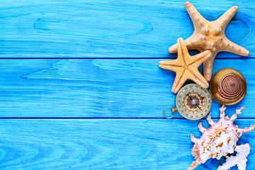 Summer time concept Flat lay composition with beautiful starfish and sea shells on blue wooden table, space for text,Sea shells