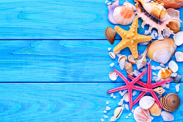 Summer time concept Flat lay composition with beautiful starfish and sea shells on blue wooden table, space for text,Sea shells
